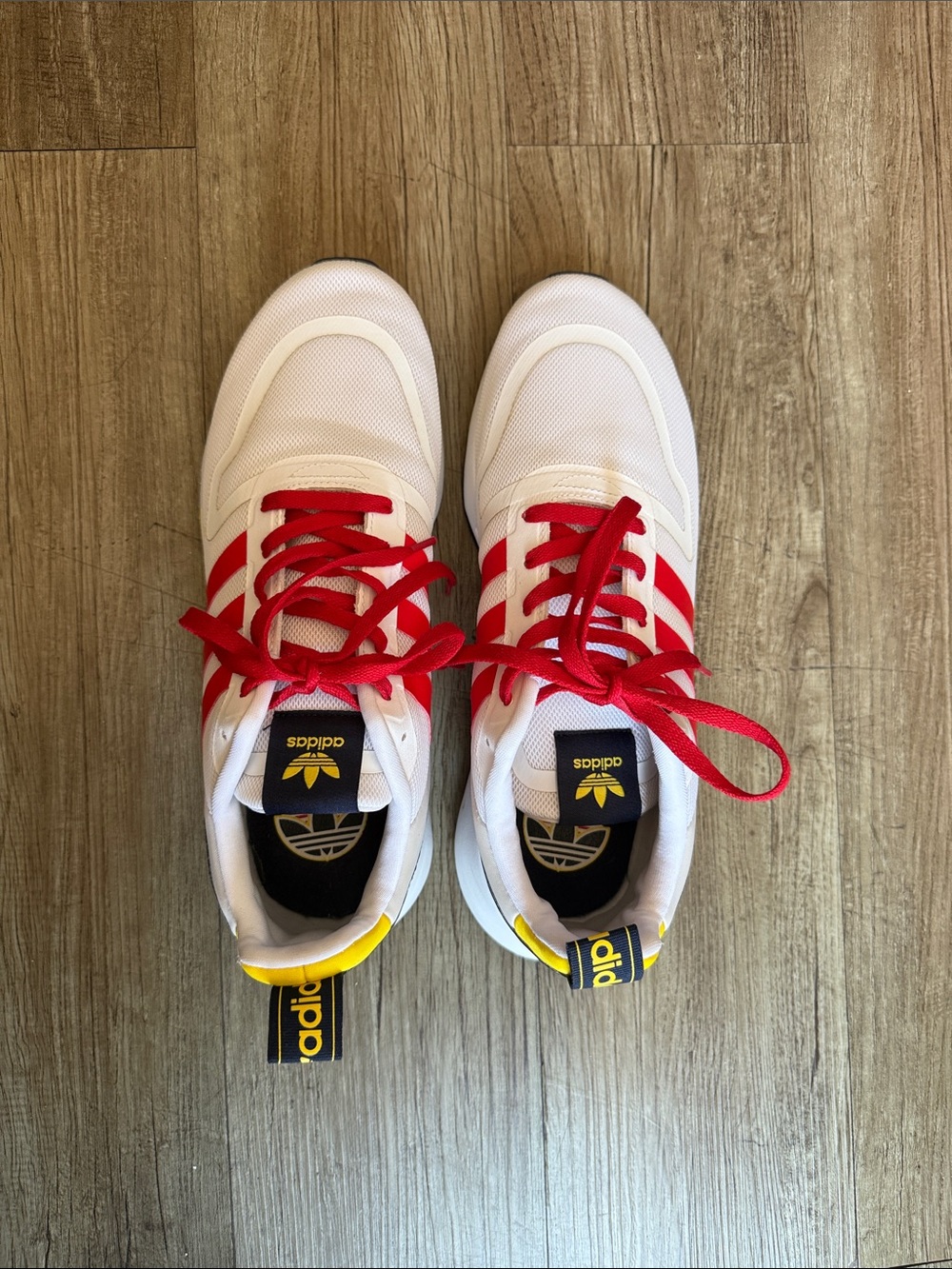 adidas White Sneakers with Red Stripes and Yellow Accents